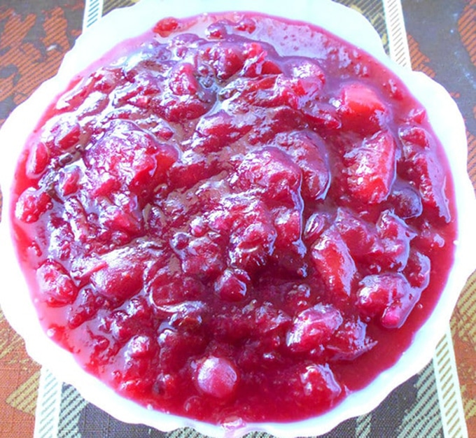 Overhead view of a white bowl with vegan cranberry sauce