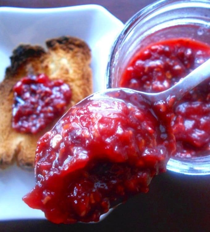 Tomato Jam made with raspberries. This is a very delicious take on regular raspberry jam. Adding tomatoes gives it a tangyness. Perfect breakfast jam recipe or use it as a sandwich spread