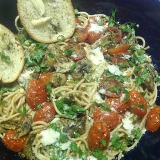 Tomato & Mushroom Spaghetti is a very easy recipe to make. Great weeknight meal and perfect for any tastebud. The tomatoes and mushrooms are roasted before being added to the spaghetti. Comfort food