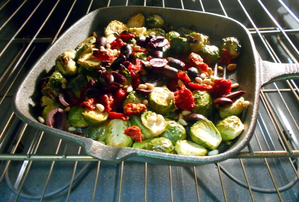 Brussels Sprouts in a grey grill inside the oven