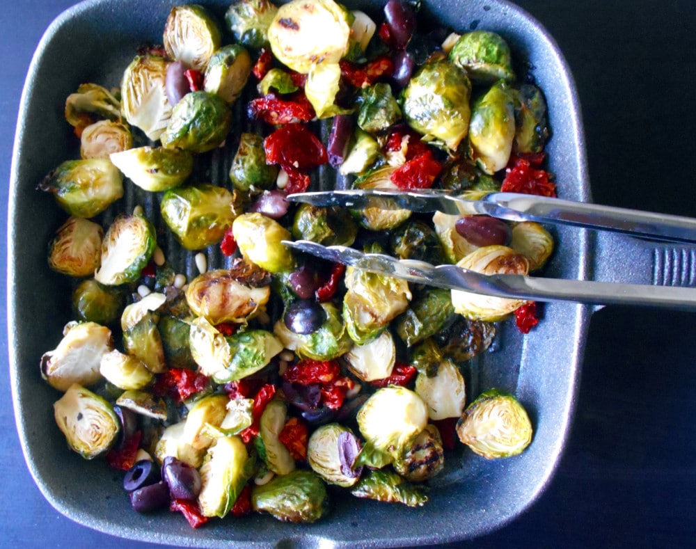 Brussel Sprouts on a grey cast iron skillet