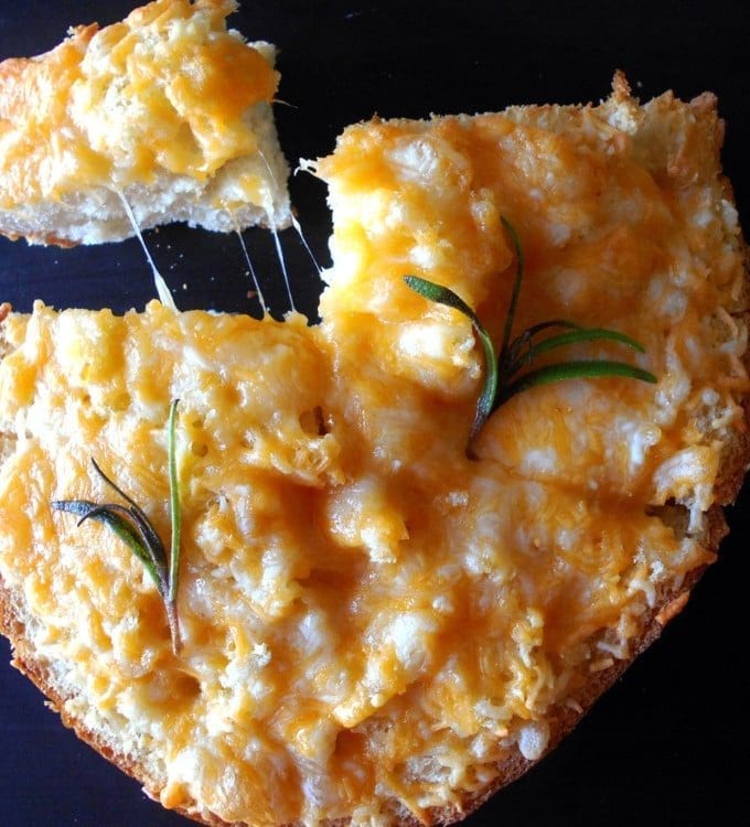Cheesy Garlic Bread Recipe. Easy appetizer recipe to go with your pizza or pasta dinner meal. Vegetarian recipe that uses rosemary and homemade garlic butter. Quick and easy recipe