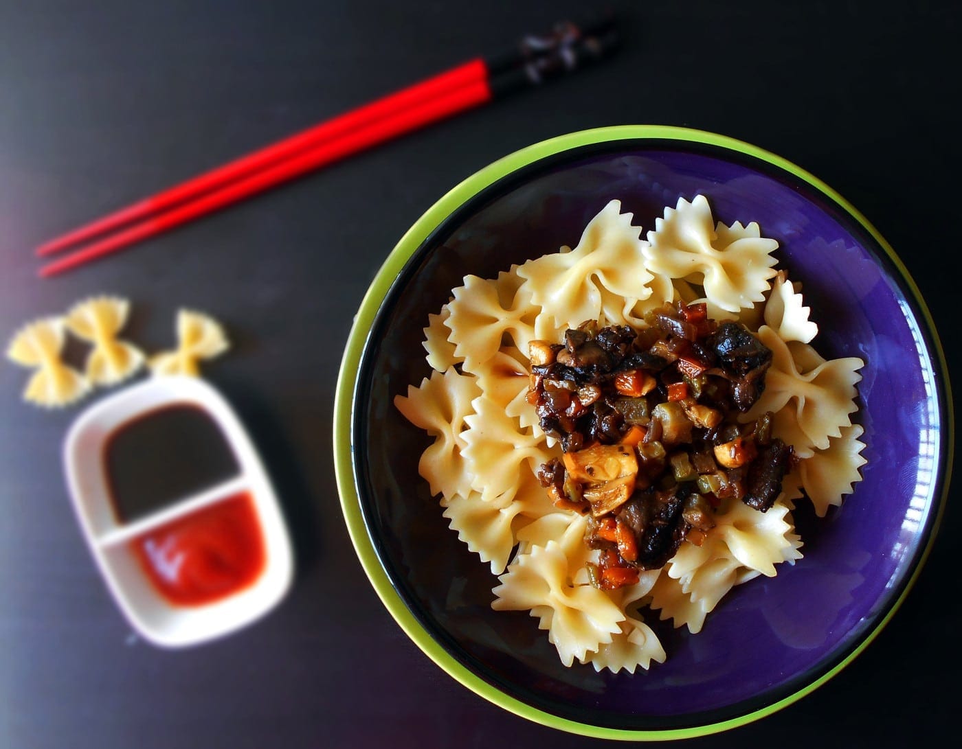 Overhead view of a blue bowl filled with pasta and stir fried veggies - Bow-tie Stir Fry