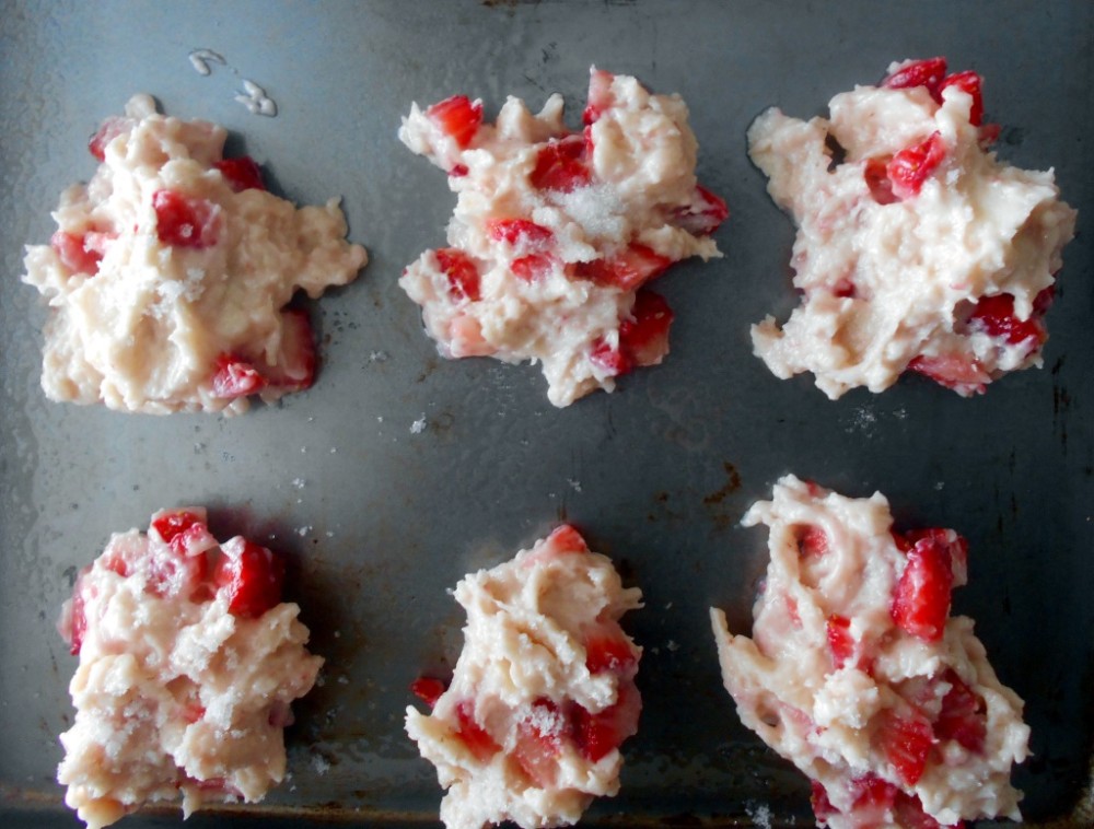 Overhead view of strawberry shortcake cookies dough on a baking tray