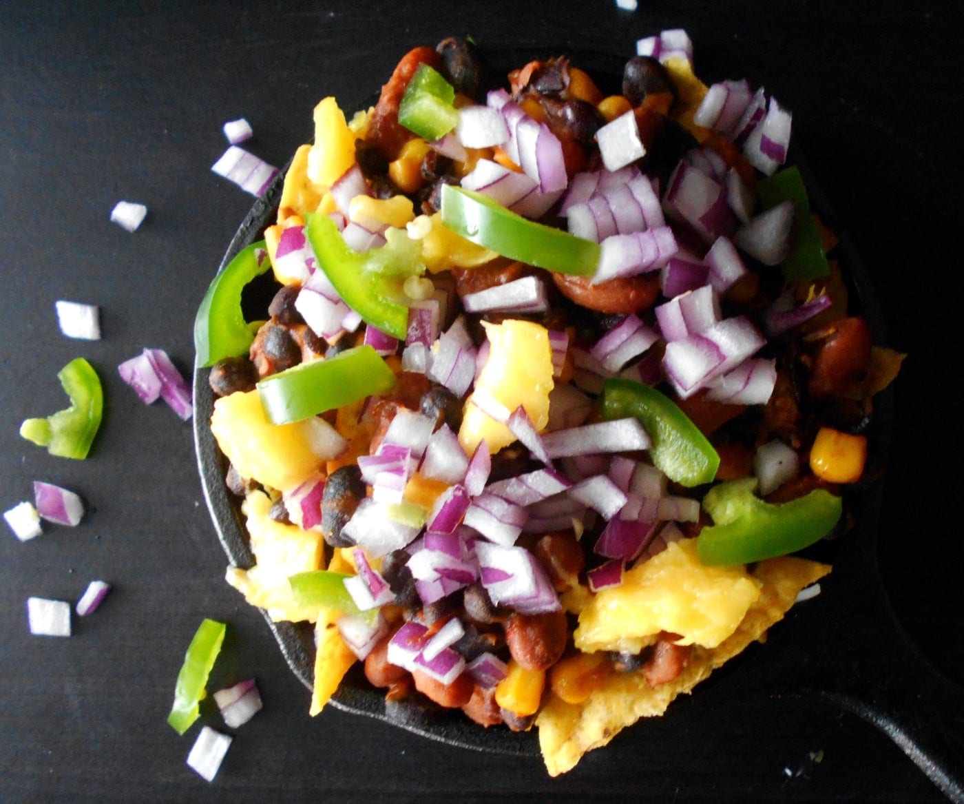 Vegetarian Nachos - Oooey-gooey, cheesy goodness. made with beans, cheese and mangos. Comfort food