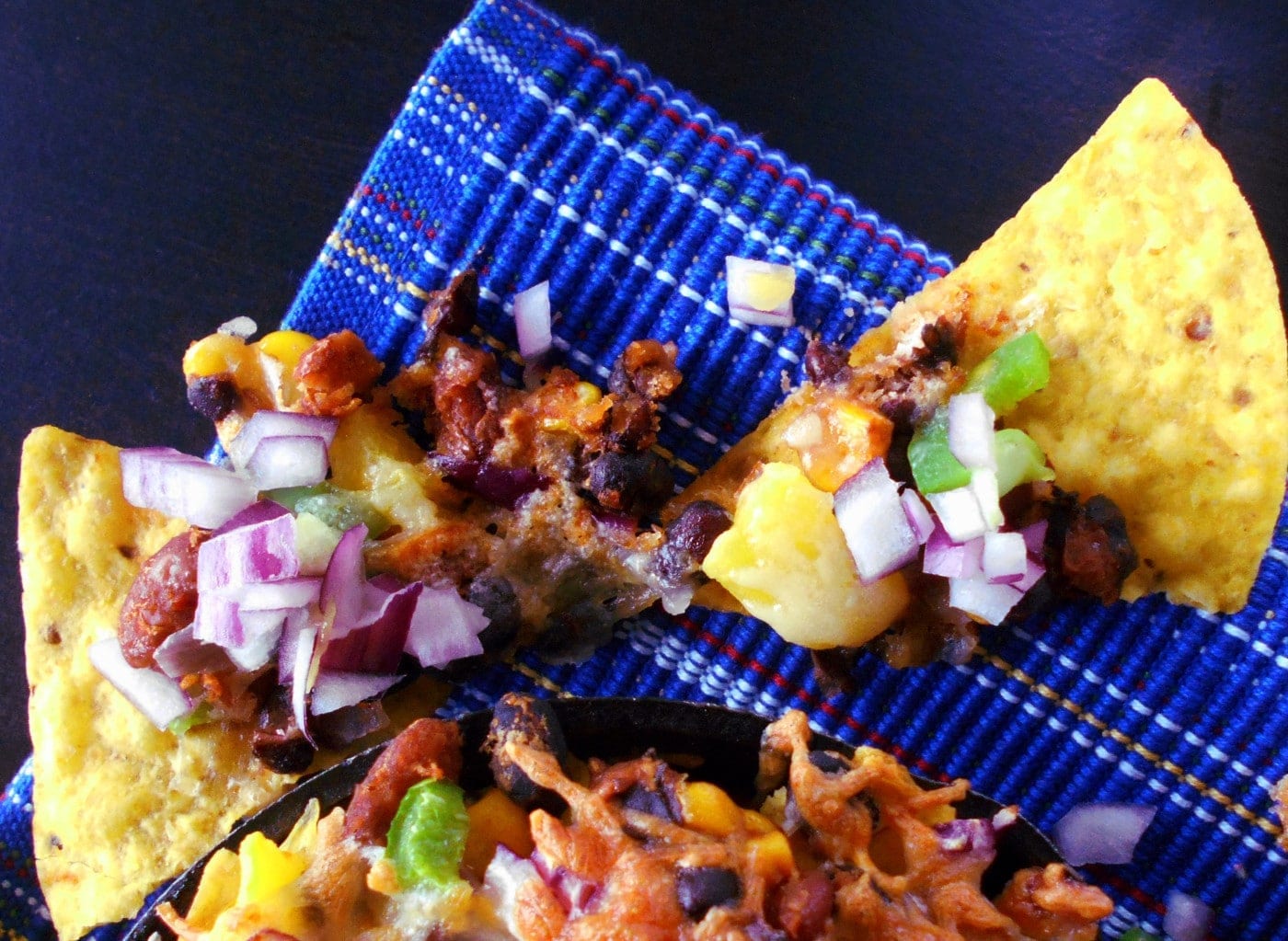 Vegetarian Nachos - Oooey-gooey, cheesy goodness. made with beans, cheese and mangos. Comfort food