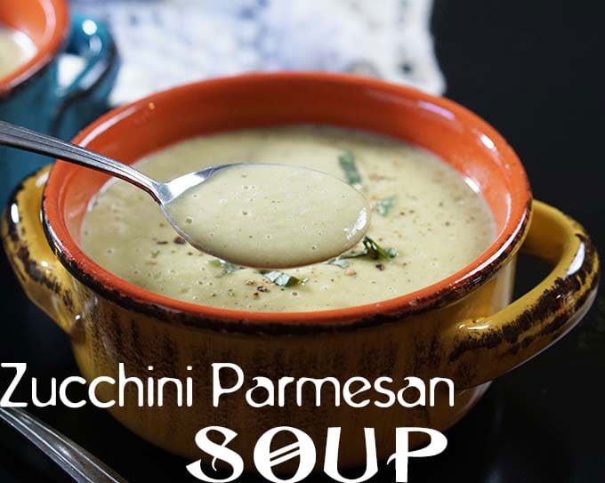 In the foreground, a closeup view of Zucchini Parmesan Soup is visible. In the background, there is a white cloth