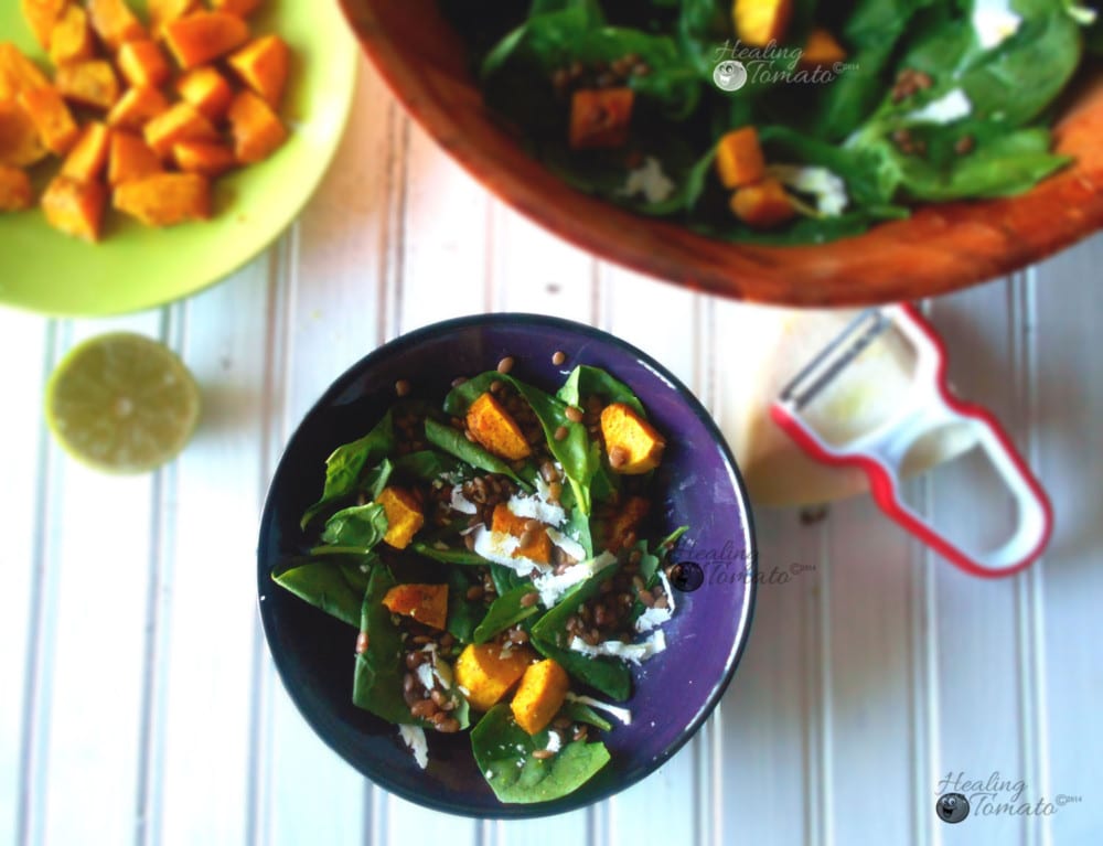 Overhead view of spinach lentil salad withspiced pumpkins