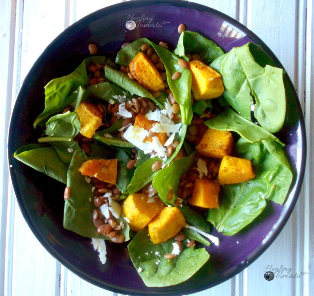 Closeup view of spinach lentil salad withspiced pumpkins