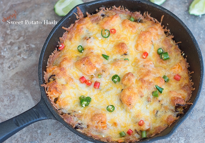 Top view of Cheesy Sweet Potato Hash Browns in a black cast iron pan