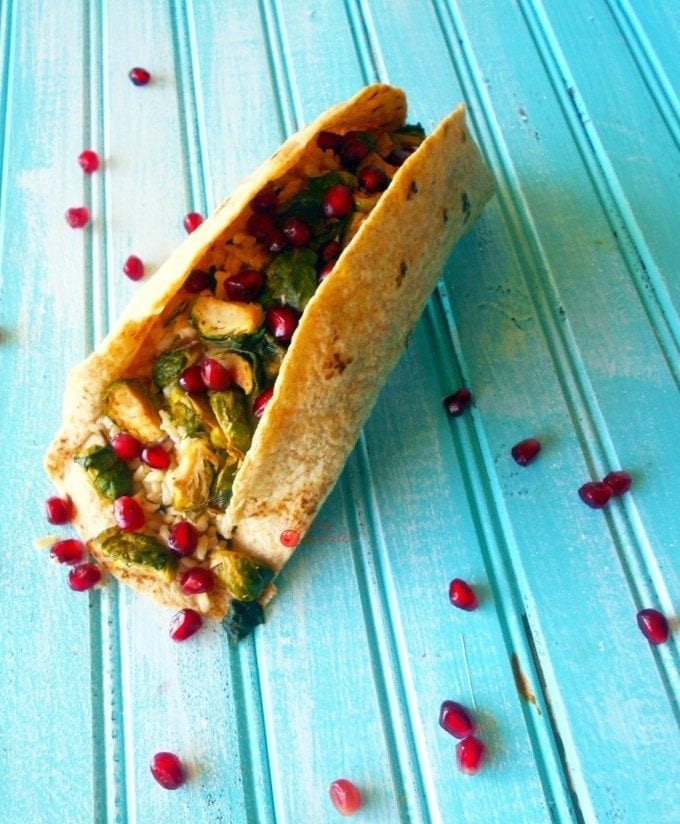 Vegan Tacos made with brown rice, brussel sprouts and pomegranate. Healthy, Quick lunch or dinner recipe.