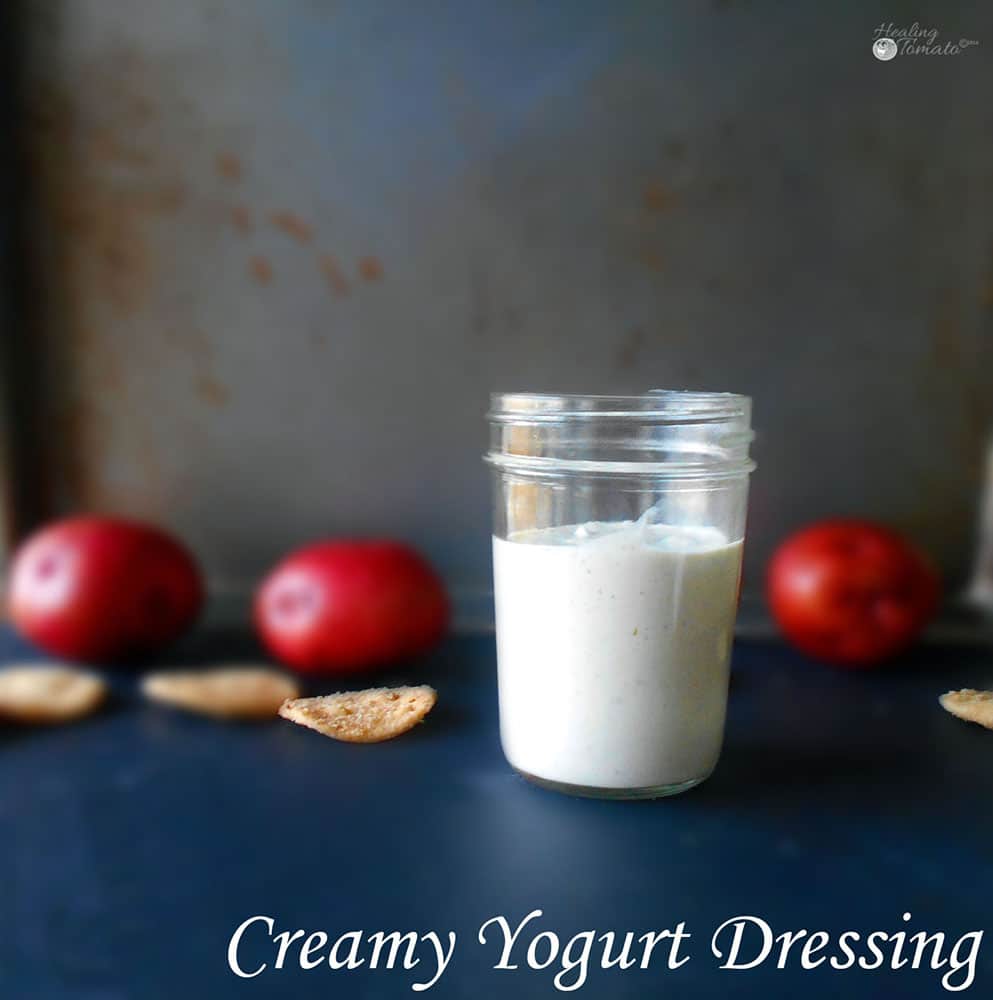 Front view of a mason jar filled with creamy yogurt dressing