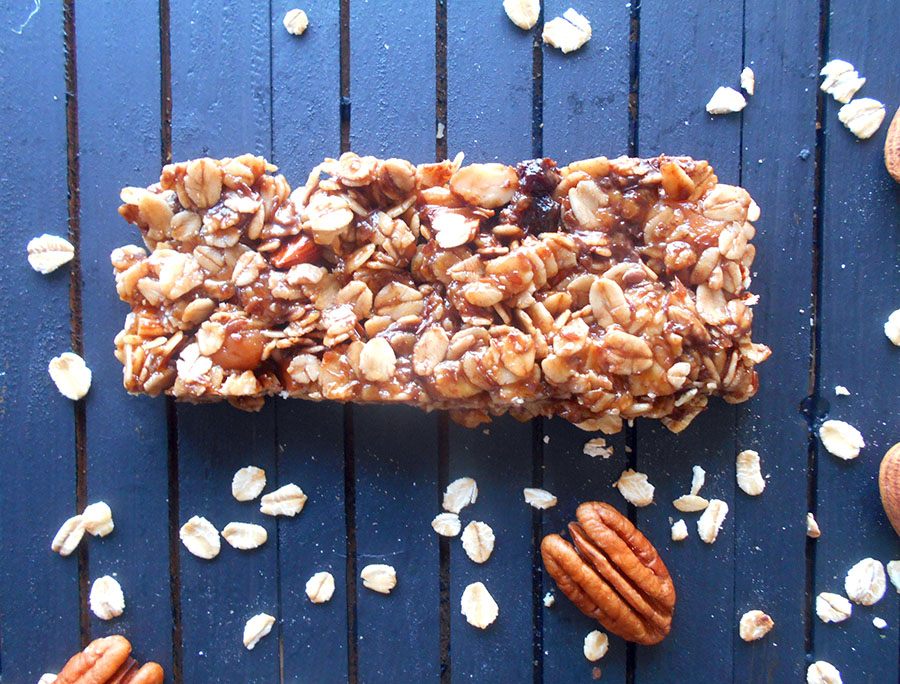 Closeup view of a granola bar with pecans and oatmeal