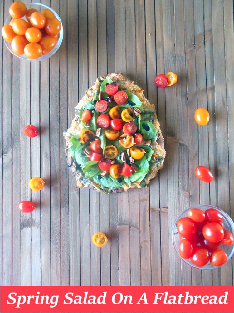 Spring Salad On A Flatbread - Made with baby spinach, cherry tomatoes and pecans. Drizzled with Balasmic Reduction Sauce. Flatbread made with Pesto, mini sweet peppers and cheese https://www.healingtomato.com/2015/04/08/spring-salad-on-flatbread-pizza