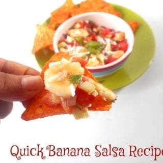 Front view of the Author Holding a Tortilla Chip Loaded with the Banana Salsa