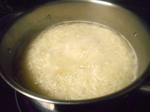 closeup view of rice boiling in water