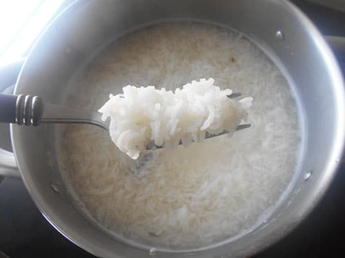 Fork filled with cooked basmati rice