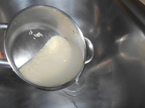 Water being drained out of the stainless steel pan