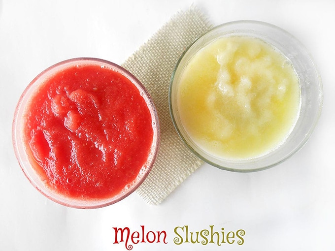 Overhead View of 2 Glasses Filled With Slusshies. One is Filled with Watermelon Slushie and the Other is filled with Honeydew Slushie. Make Slushies without a slushy machine