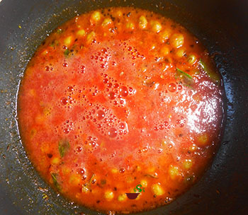 closeup view of chickpeas in watermelon sauce