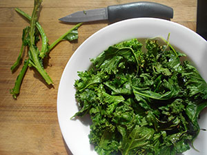 chopped kale in a white bowl - Kale Salad