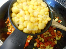 Sweet Corn kernels added to a stir fry pan - Vegan Meatloaf recipe