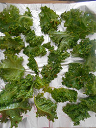 Spicy Kale Chips recipe made with Sriracha sauce. Quick snack idea that is also a healthy snack. Instead of snacking on potato chips, try this healthy chips