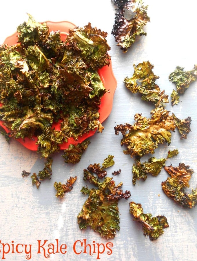 Spicy Kale Chips recipe made with Sriracha sauce. Quick snack idea that is also a healthy snack. Instead of snacking on potato chips, try this healthy chips