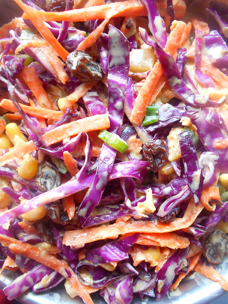 Closeup view of red cabbage coleslaw in a bowl 