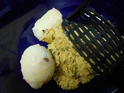 2 Baked potatoes (peeled) and placed into bowl with blended squash ready to be mashed together