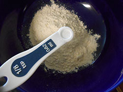⅛ measuring tsp salt on a bowl with flour