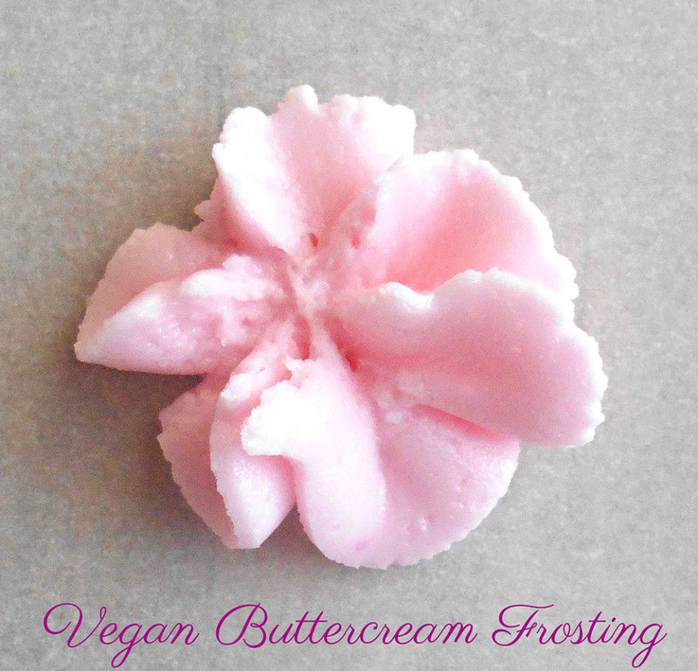 Closeup view of a single flower made from piping vegan buttercream frosting