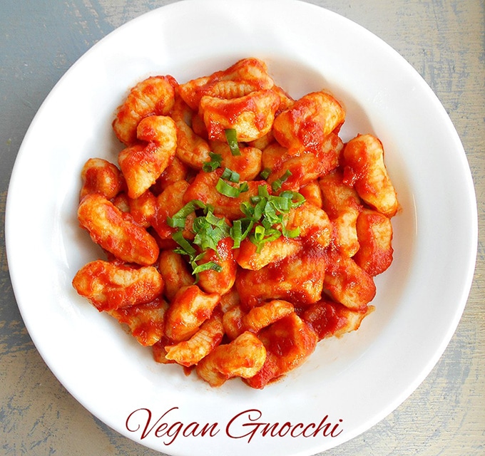 Overhead View of a White Plate Filled With Gnocchi in a Red Pasta Sauce
