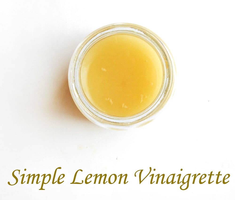 Overhead view of simple lemon vinaigrette in a glass jar
