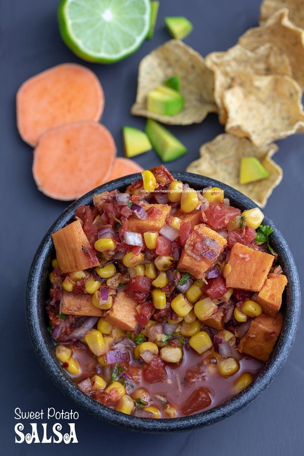 Overhead view of sweet potato salsa in a black bowl