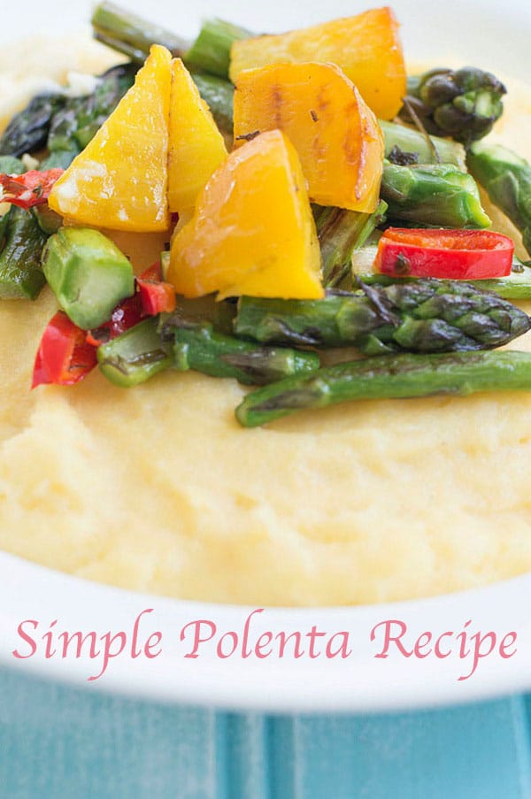 Closeup View Cooked Golden Beets, Red Peppers and Asparagus and Partial View of the Creamy Polenta Bed on a White Plate