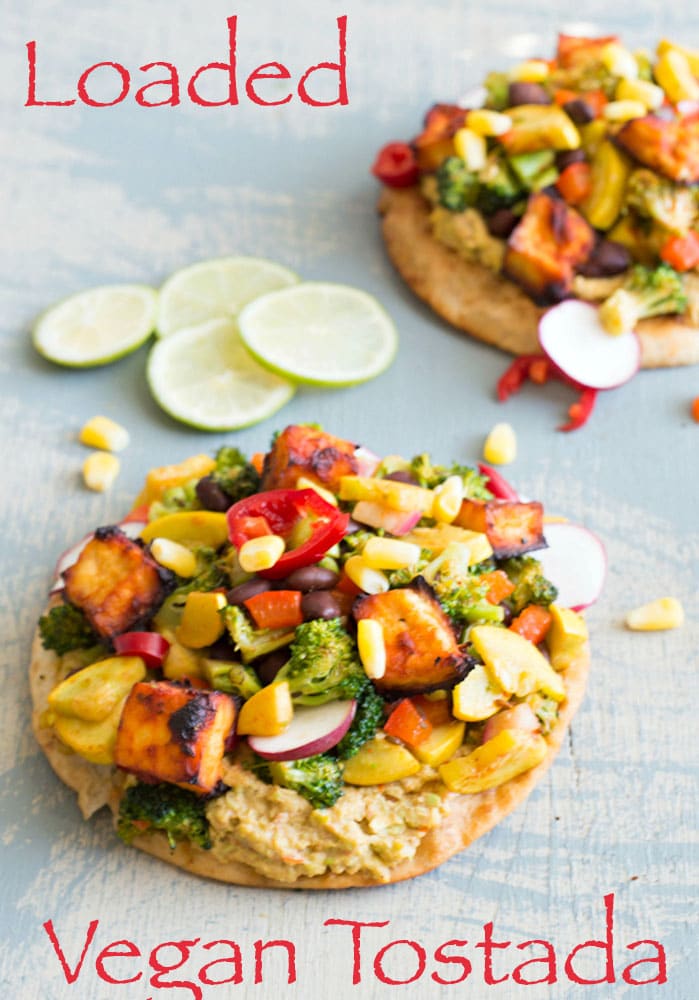 This LOADED vegan tostada is made with salsa marinated tofu and filled with delicious veggies. This is a perfect vegan dinner idea for any weeknight.