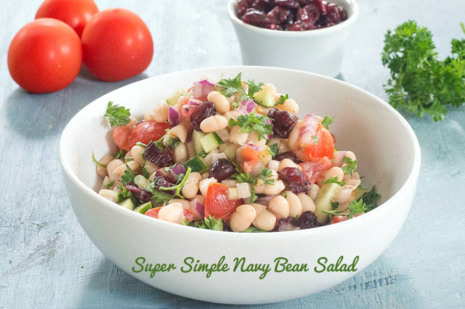 Front view of navy bean salad in a white bowl. Cheap salad recipes.