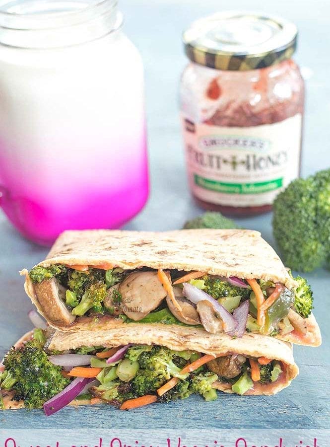 Sweet & spicy veggie flatbread sandwich that is great for any brown bag lunch idea. The base is made with Tofu + Smucker’s Strawberry Jalapeno Fruit & Honey