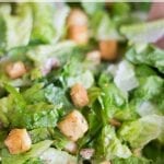 Make this healthy vegan Caesar salad recipe from Healing Tomato for lunch or for a dinner appetizer. The recipe includes vegan dressing and vegan Parmesan
