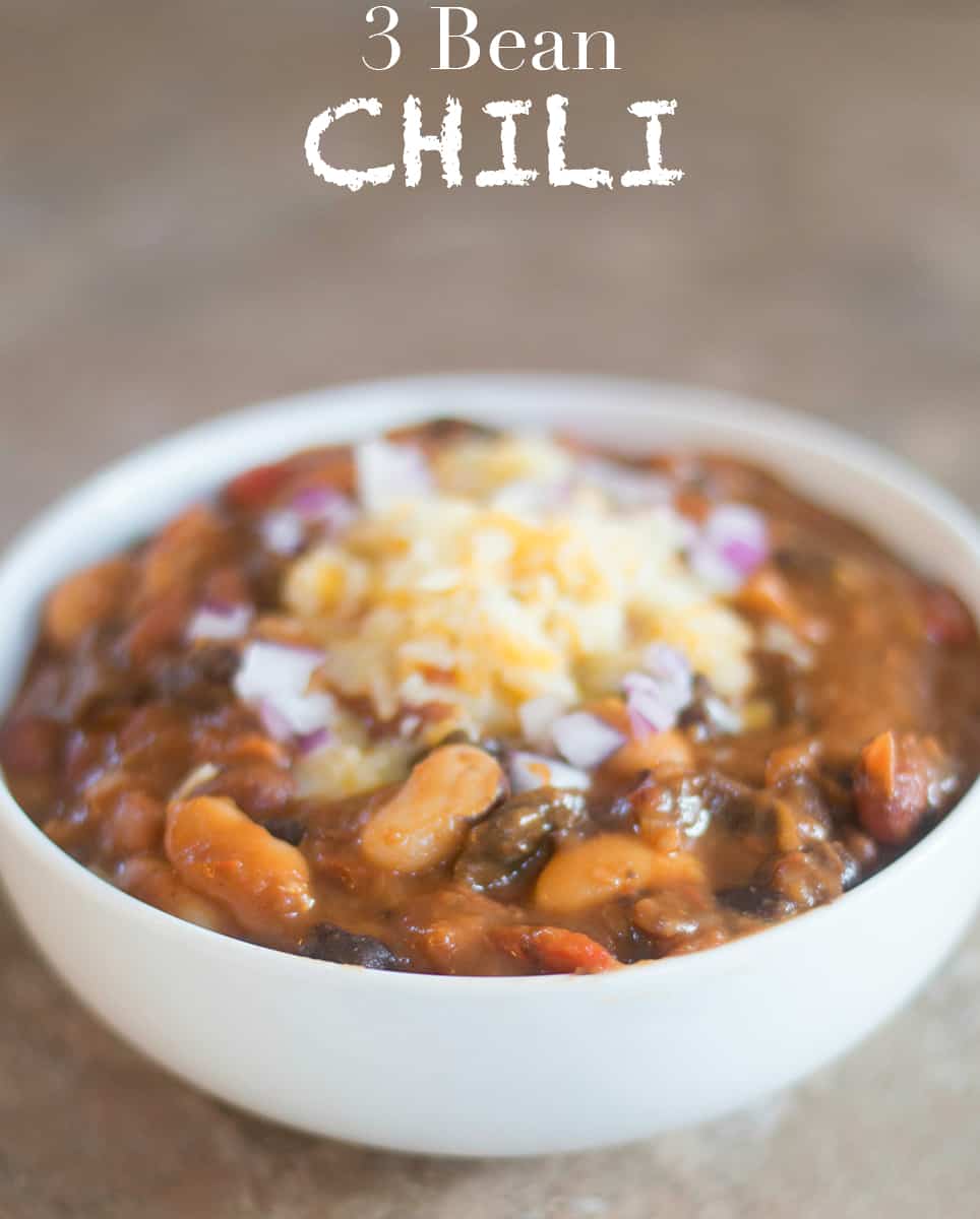 Quick and easy game day vegetarian chili recipe made with 3 types of beans. Can be put in a slow cooker or made stove top. This meatless chili is delicious!