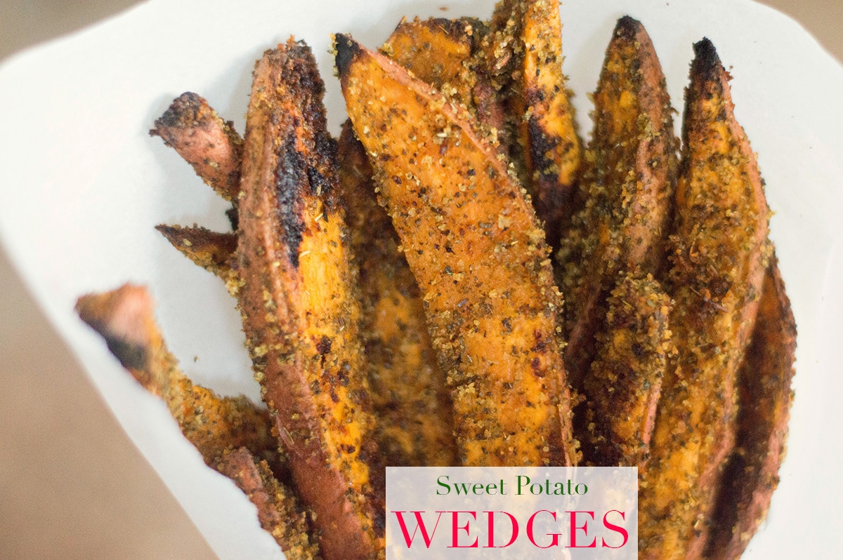 Front view of long sweet potato wedges in standing up with a white background.    Easy Thanksgiving Side Dishes