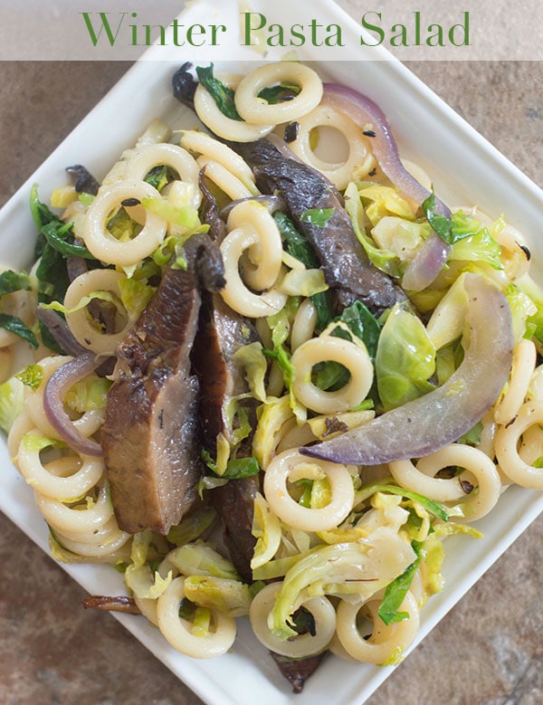 Simple winter pasta salad made with portobello mushrooms, baby kale, anelli pasta & vegan creme fraiche. Make in under 1 hour and the perfect weeknight meal