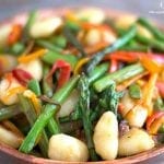 Gnocchi brown buttered in vegan butter + fresh rosemary. Add roasted asparagus + sweet red peppers. Mix with a dirty vinaigrette. Best 30 minute meal ever!