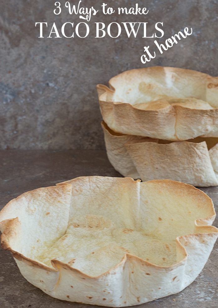 Front view of one taco bowl and 2 stacked in the back - Make Taco bowls in a cake pan