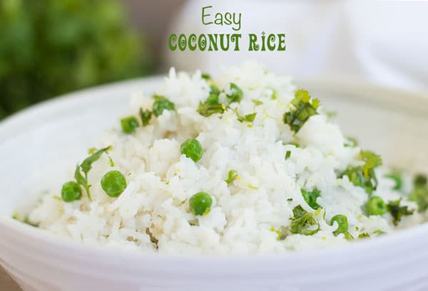 Portrait view of a white bowl with coconut rice and peas