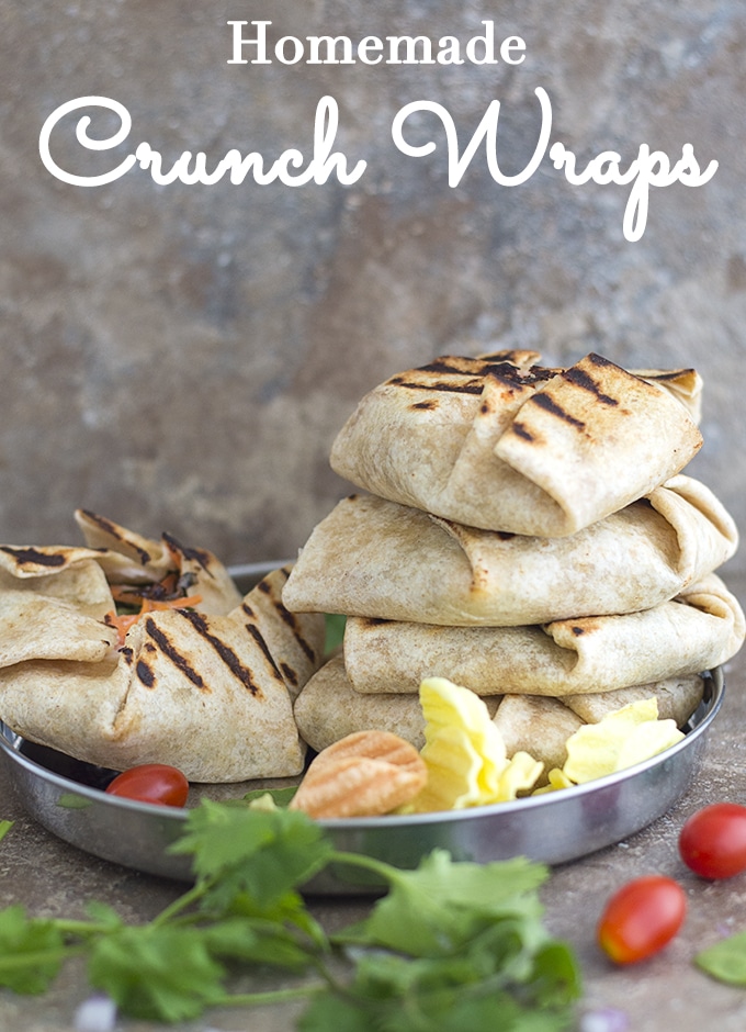 Stack of 4 crunch wraps on a steel plate