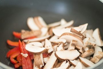 Button Mushrooms and Red Bell Pepperin Stir Fry Pan
