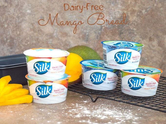 Silk Peach & Mango Yogurt and Silk Blueberry Yogurts arranged on a Brown Tile and a Black Wire Rack - Mango Bread
