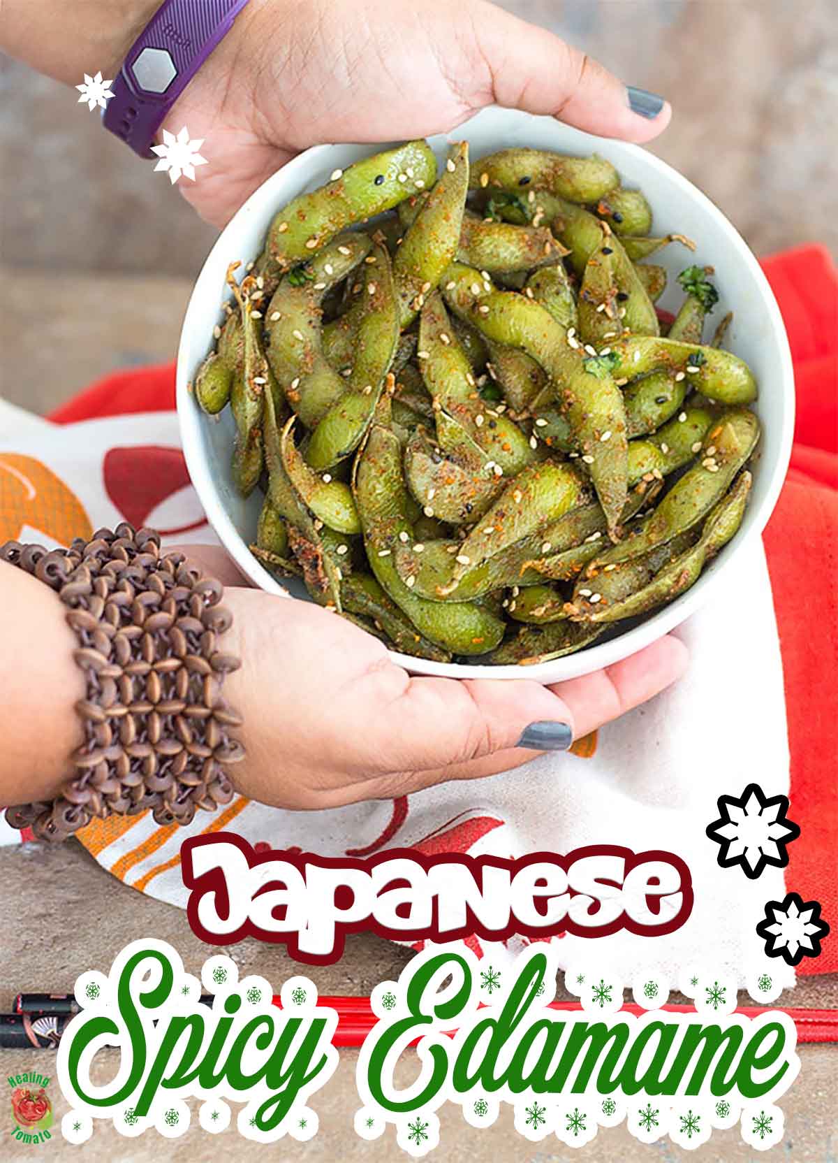 Front view of the author's hands holding a white bowl filled with edamame pods